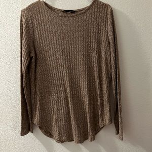 Tan long sleeve shirt. Size L. Button detailing on back.